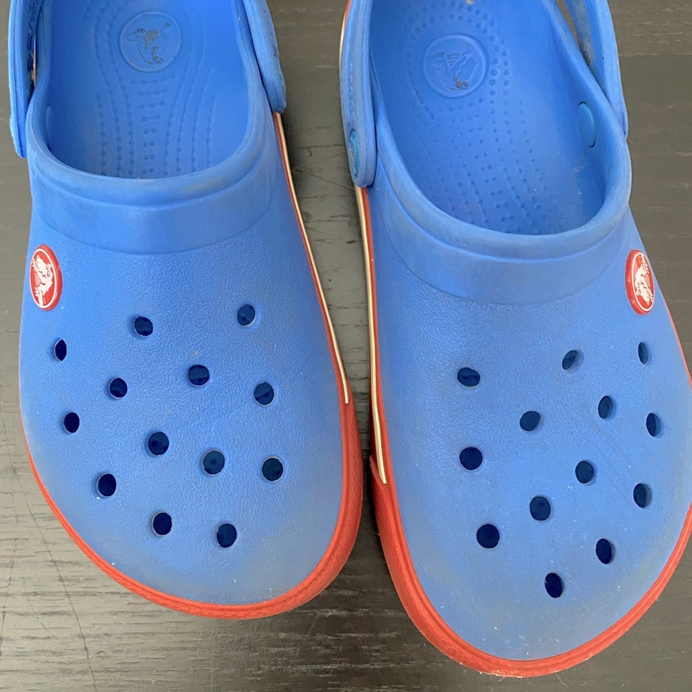 Used kids crocs, some visible wear.